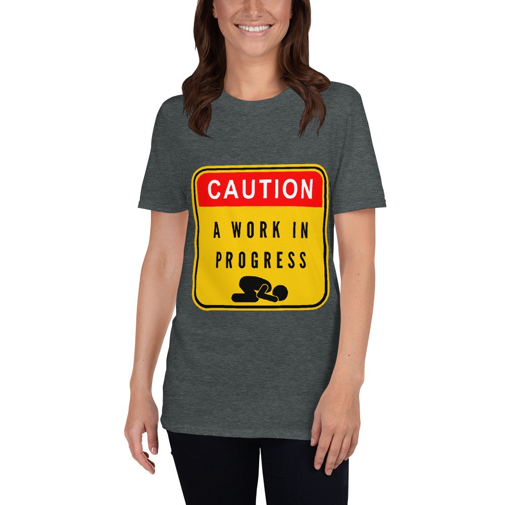Caution a work in progress makes for a great staple t-shirt that complements any outfit. It's made of a heavier cotton and the double-stitched neckline and sleeves give it more durability, so it can become an everyday favorite.