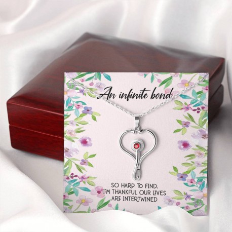 An Infinite Bond Stethoscope Necklace Embellished with Red Crystal