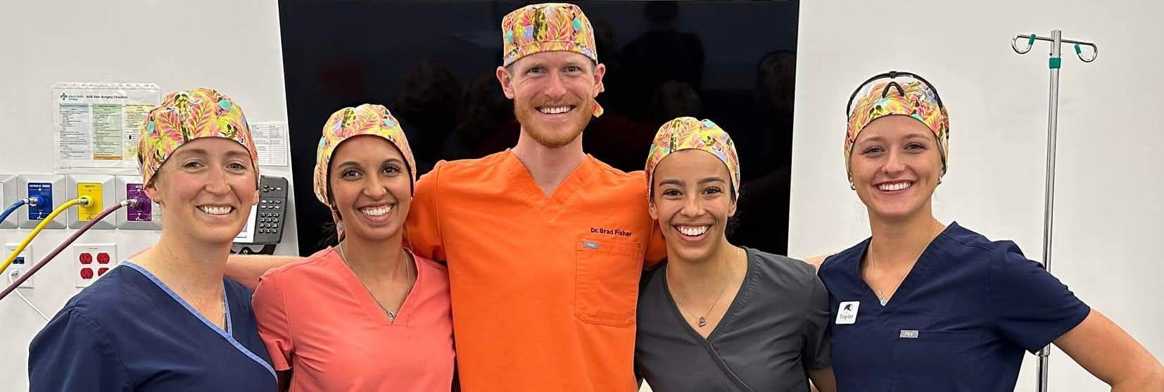 Surgical team wearing matching jojo scrub caps